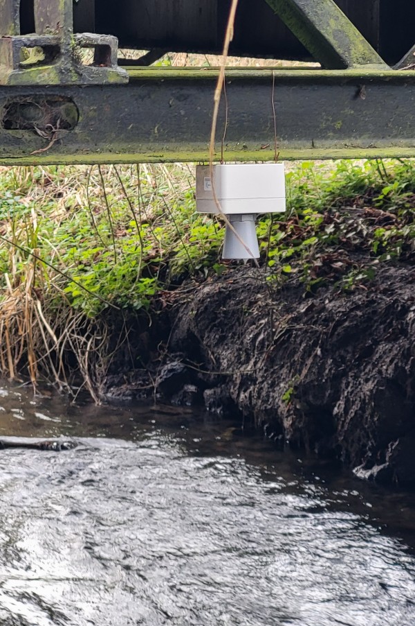 an ultrasonic distance sensor hung under a bridge